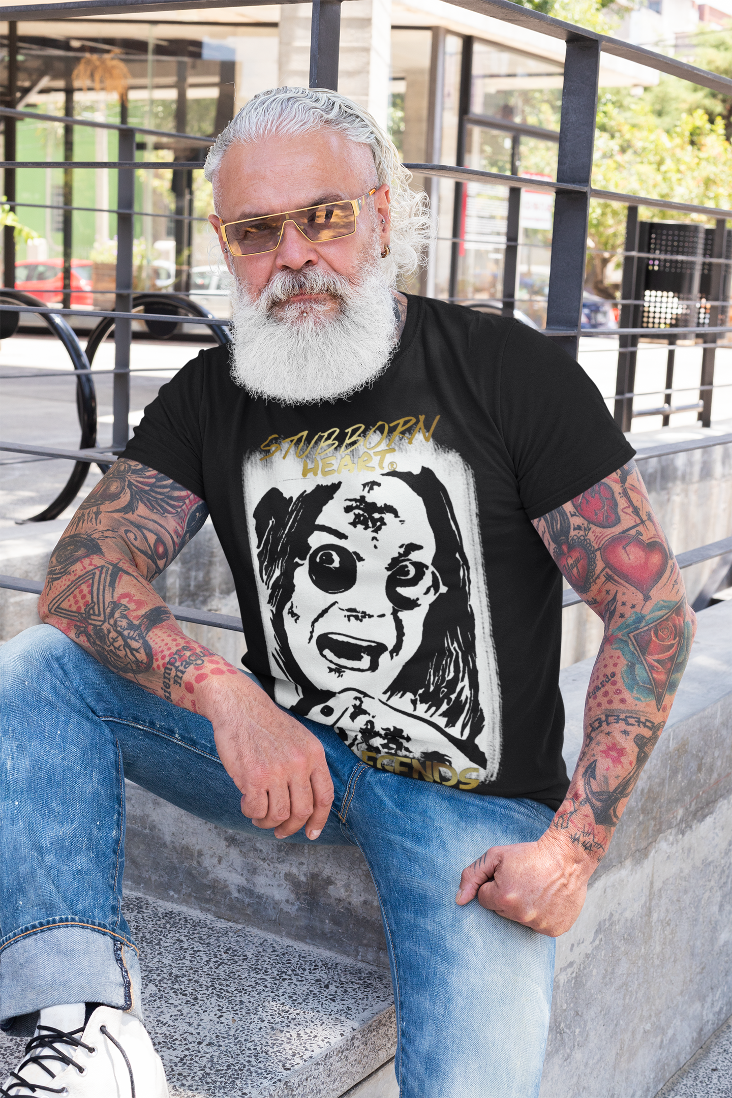 OZZY OSBOURNE inspired T-Shirt on the LEGENDS COLLECTION: by designer STUBBORN HEART Apparel. Large full front handdrawn black & white portrait of the Black Sabbath singer on a tee, worn by cool older rock music fan